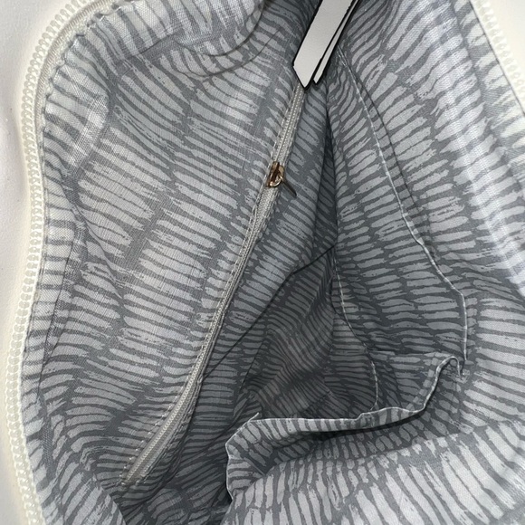 White Crossbody Bag with Intricate Cutout Design - Picture 4 of 5